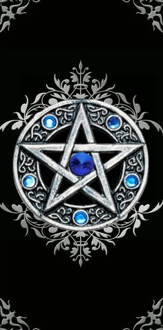 a pentagramil with blue eyes on a black background, surrounded by ornate designs