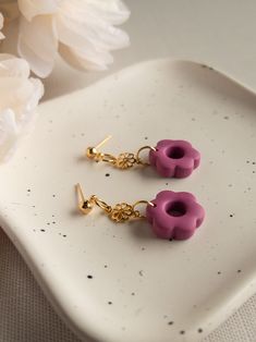 The floral vibes are strong with these tiny daisy drop earrings. Style these with your favorite white button up or floaty floral summer dress, the possibilities are endless. Get creative and have fun getting dressed! Perfect for everyday. -DETAILS- Materials: Polymer Clay, Gold Plated Hardware Color: Bubblegum Pink Length: About 1.25in -SHIPPING- All orders are shipped in a small shipping box via USPS First-Class Mail. Shipping upgrades are available at checkout. Due to various settings on your Trendy Adjustable Flower Drop Earrings, Trendy Everyday Flower Drop Earrings, Dainty Earrings With Flower Charm For Summer, Summer Flower Earrings Gift Feminine Style, Trendy 3d Flower Earrings, Trendy Everyday Flower Earrings, Dainty Flower Earrings For Summer, Summer Flower Earrings Gift, Feminine Summer Flower Earrings For Gift