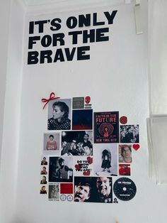 a white wall covered in pictures and magnets with the words it's only for the brave