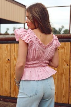 We are here for all the colors this season & this lavender top is so cute! Features a v-neck, ruffle hem & sleeve, elastic waist & raw edge. 100% Cotton Jacie is 5'4", a size 26 & 34B wearing a small Casual Pink V-neck Top For Summer, Fitted V-neck Tops With Ruffle Hem, Relaxed Fit V-neck Top With Ruffles, Feminine V-neck Top With Ruffle Hem, Summer V-neck Peplum Top With Ruffle Hem, Spring V-neck Top For Day Out, Chic V-neck Top In Relaxed Fit For Spring, Chic Relaxed Fit V-neck Top For Spring, Spring V-neck Top For Day Out With Relaxed Fit