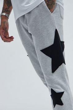 Available In Heather Grey. Elastic Waistband Drawstring Side Pockets Back Pockets Patch Details Disclaimer: Patch Placement May Vary. 80% Cotton 20% Polyester Imported | Mens Tyson Stars Skinny Flared Sweatpants in Heather Grey size Large by Fashion Nova Casual Cotton Bottoms With Star Print, Flare Sweats Men, Cotton Bottoms With Star Print For Streetwear, Mens Flared Sweatpants, Cotton Star Print Pants For Streetwear, Casual Star Print Loungewear Bottoms, Grey Sweatpants Guys Print, Flared Sweatpants, Service Women