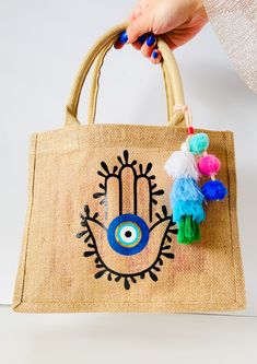 Designed By Amida By Zaa© Small Size: 12.2”x9.8” Inches Medium Size : 16.5"x13" Inches Burlap Tote Bag Hand Evil Eye, Burlap Tote Bags, Burlap Tote, Jute Tote Bags, Diy Embroidery Designs, Jute Totes, Jute Bags, New Crafts, Hamsa Hand