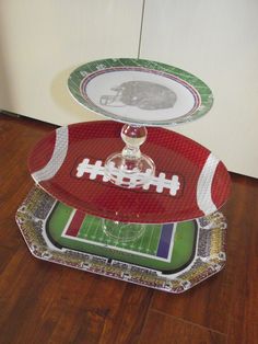 two football plates stacked on top of each other in the shape of an american football