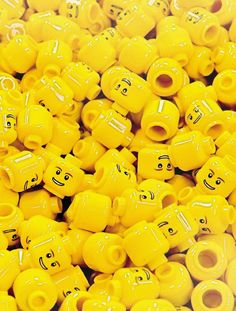 yellow plastic beads with smiley faces on them