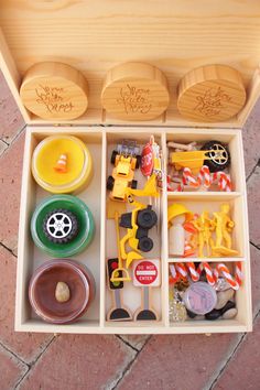 a wooden box filled with lots of toys