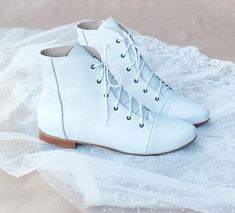 This Womens Wedding Shoes item by AnnaMaratti has 230 favorites from Etsy shoppers. Ships from Poland. Listed on Feb 6, 2023 Outside Winter Wedding Ideas, Flat Wedding Boots For Bride, Bridal Combat Boots, White Wedding Boots For Bride, Wedding Boots For Bride, Winter Wedding Boots, Country Wedding Boots, White Wedding Boots, White Lace Up Boots