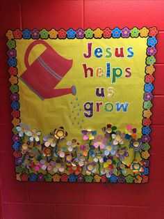 a bulletin board that says jesus helps us grow on the side of a red wall