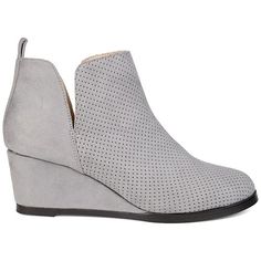 Journee Collection Womens Mylee Bootie Trendy and Chic are the Mylee bootie by Journee Collection. This stylish bootie features a soft faux suede material with a perforated detail on the top. The deep V cut-outs make for easy pull-on entry while the slight wedge adds attractive height. Heel Height: approx. 2 1/2" Heel Type: Wedge  Platform Height: approx. 1/2" Shaft Height: approx. 3 1/2" Top Circumference: approx. 11" Shoe Width: Medium Closure Type: Pull-on Toe Style: Round Lining: Fabric Uppe Gray Ankle-high Spring Boots, Gray Ankle-high Boots For Spring, Chic Gray Boots For Spring, Chic Gray Spring Boots, Gray Pointed Toe Boots For Spring, Spring Gray Pointed Toe Boots, Suede Material, Journee Collection, V Cuts