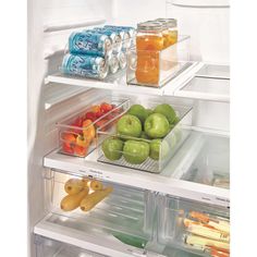 an open refrigerator filled with lots of food next to drinks and fruit on the shelves