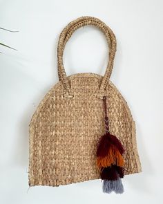 Handwoven palm leaf totes (in Baja) w/ hand made wool tassel from Chiapas SIZE: M PLEASE NOTE: orders ship 2nd week of JULY Brown Tasseled Beach Bag For Travel, Brown Tassel Beach Bag For Travel, Brown Fringe Tote Beach Bag, Brown Beach Bag With Tassels For Everyday Use, Bohemian Brown Beach Bag With Fringe, Brown Tassel Beach Bag For Everyday Use, Everyday Brown Beach Bag With Tassels, Brown Straw Bag With Tassels For Daily Use, Bohemian Brown Palm Leaf Shoulder Bag