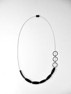 Silver, Blackstone, and Rubber Necklace on Stainless Steel Cable by Boo Poulin (Silver Necklace) | Artful Home Modern Onyx Jewelry With Black Beads, Modern Black Jewelry, Modern Black Sterling Silver Necklace, Everyday Black Single Strand Necklace, Contemporary Adjustable Black Jewelry, Modern Black Onyx Necklace, Rubber Necklace, Stainless Steel Cable, Artful Home