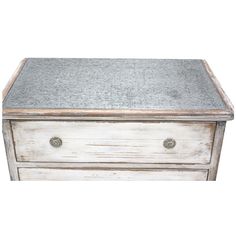 an old white wooden chest with metal top