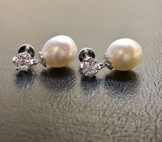 DeKara Designs Collection Metal- 95% Platinum, 5% Iridium. Stones-2 Pear Shape South Sea Pearls 11.3 MM. 2 Old European Cut Round Diamonds G-H Color VS1 Clarity 1.80 Carats, 16 Round Old Mine Cut Diamonds G Color SI1 Clarity 0.04 Carats. Measurement- 1 Inches Long, 0.50 Inch Wide. Handmade Platinum Art Deco Inspired South Sea Pearl Diamond Drop Earrings. There are two beautiful South Sea Pearls dangling right underneath two round Antique Old European Cut Diamonds. There are eight bezel/burnish s Gia Certified Pear Shaped Formal Earrings, Gia Certified Pear Shaped White Gold Earrings, Elegant Gia Certified Pear Earrings, Pear-shaped Gia Certified White Gold Earrings, Drop Pearl Earrings, Sea Pearl, South Seas, South Sea Pearls, Sea Pearls