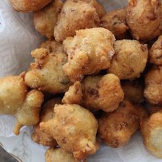 some fried food is on a white plate and ready to be eaten by someone else