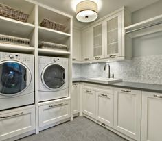 a washer and dryer in a white laundry room