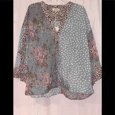 Umgee Dusty Mint Mix Top Available In Size S-2xl Mixed Printed Split Ruffle Sleeve Top With Metallic Threading Details Made Of 100% Polyester Made By Umgee Blue Casual Tops With Mixed Print, Casual Blue Tops With Mixed Print, Fall Floral Print Light Blue Top, Fall Light Blue Floral Print Top, Light Blue Bohemian Top For Fall, Blue Trendy Loose Fit Tops, Trendy Blue Flowy Blouse, Trendy Blue Flowy Top, Blue V-neck Blouse For Layering