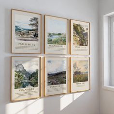 four framed pictures hang on the wall next to a window