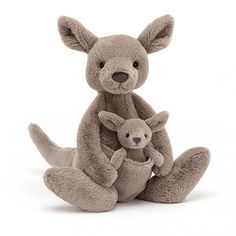 a stuffed kangaroo and its baby are sitting together