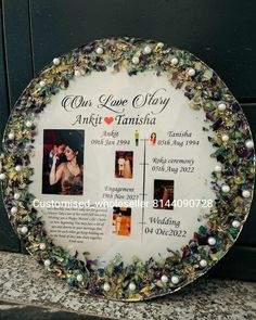 the wedding plaque is decorated with pearls and flowers