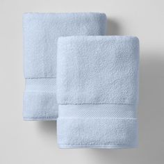 two light blue towels folded on top of each other