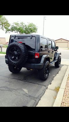 the jeep is parked on the side of the road