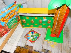 an assortment of children's toys and games on a table