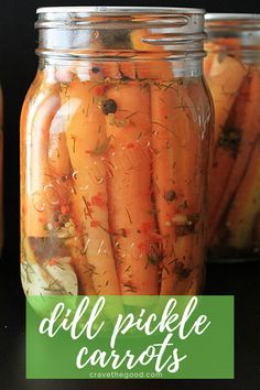 jars filled with pickled carrots sitting on top of a table