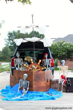 a trunk with skeletons in it sitting on the ground