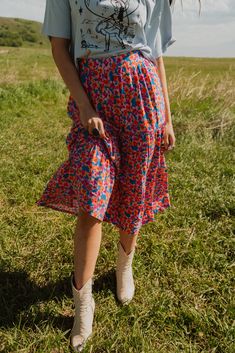 The floral skirt is everything we've wanted and more! Fun, vibrant colors for the win. Midi skirt 100% rayon Elastic waistband Model is 5'3" and wearing a size small. The length of a size small measures 33". X-Small: 0-2 Small: 2-4 Medium: 6-8 Large: 10-12 Multicolored Skirt Outfit, Floral Print Flared Skirt Bottoms For Summer, Casual Midi Length Floral Print Bottoms, Floral Print Flowy Skirt, Spring Midi-length Bottoms With Floral Print, Spring Floral Print Midi-length Bottoms, Spring Floral Print Midi Bottoms, Knee-length Floral Print Bottoms For Spring, Floral Print Midi-length Bottoms For Day Out