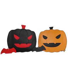 two pumpkins with bats on them sitting next to each other, one is black and the other has red eyes