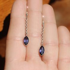 These earrings are made from stunning iolite, It has a delicate and quite pretty violet blue color that is unlike other gemstones, although it has been compared to a light blue sapphire. It is this reason that it is sometimes known as "water sapphire". It is similar to tanzanite but is more blue than violet. The marquise shaped gemstones are 5 mm x 10 mm and are set in sterling silver, The length of the earrings on the sterling silver chain and ear wires is 1 7/8". You will receive your earrings gift boxed on a jewelry card stating gems and metals used. Silver Tanzanite Drop Earrings, Purple Tanzanite Gemstone Earrings, Blue Tanzanite Teardrop Earrings, Blue Amethyst Dangle Earrings, Light Blue Sapphire, Bleu Violet, Jewelry Card, Sterling Silver Chain, Earring Gifts