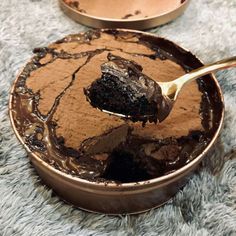 there is a spoon with some cake in it