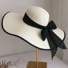 Boho Floppy Beach Hat With Bow * Black And White * Adjustable * Lightweight * Hat Arrives Folded * 60% Polyester 40% Polyvinyl Chloride * Foldable * Comes Folded * One Size 22.8 Crown * Do No Wash Black Summer Straw Hat For The Pool, Black Summer Straw Hat For Pool, Black Straw Hat With Curved Brim For Pool, Summer Black Straw Hat For Pool, Black Hat For Beach Season Sunbathing, Black Hat For Sunbathing During Beach Season, Black Summer Hats For Pool, White Lightweight Hat For Vacation, White Sunbathing Hats With Upf 50+