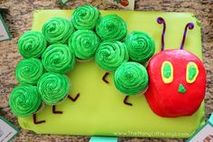 the very hungry caterpillar cake is made to look like it's eating an apple