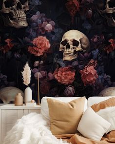 a bedroom with skulls and flowers on the wall