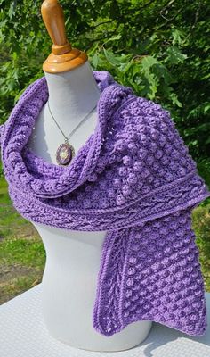 You'll be warm and cozy this fall and winter wrapped in a luxurious crocheted scarf in gorgeous purple lavender!  Handmade with exquisite popcorn stitching with detailed edging, this wrap measures over 5' long by 14" wide. Garment can be created in most any colors imaginable! Great for gift giving around the holiday season! It's not too early to be thinking of your Christmas list! Contact me for a custom order today! Purple Shawl Scarf For Winter, Handmade Purple Shawl For Winter, Purple Bohemian Scarves For Winter, Purple Bohemian Scarf For Winter, Handmade Purple Winter Shawl, Crochet Popcorn, Purple Winter Shawl Scarf, Purple Crochet Scarf One Size, Purple Crochet Scarves One Size