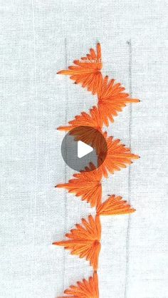 an orange flower is being stitched on to a white shirt with the words, how do you sew?