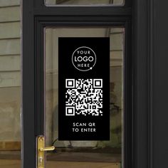 a black door with a qr code on it