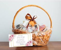 a basket filled with cookies next to a card