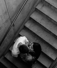 black and white photograph of a man on the stairs