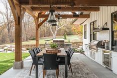 an outdoor kitchen and dining area is shown