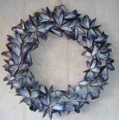 a close up of a wreath made out of seashells