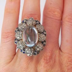 #ad Vintage Cabochon Sapphire Ring For Wedding, Vintage Multi-stone Oval Sapphire Ring, Vintage Oval Multi-stone Sapphire Ring, Antique 14k Gold Moonstone Ring, Vintage Cabochon Moonstone Ring For Anniversary, Victorian Oval Cabochon Moonstone Ring, Vintage Dome Ring With Cabochon In 14k Gold, Antique Cabochon Sapphire Ring For Formal Events, Vintage Round Cabochon Moonstone Ring