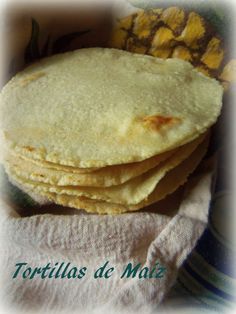 a stack of tortillas sitting on top of a white towel