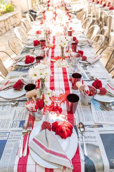 the table is set with red and white napkins