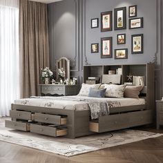 a bedroom with a bed, dressers and pictures on the wall