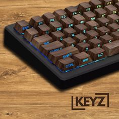 the keyboard is made out of wood and has blue light on it's keys