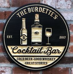 a sign on the side of a brick wall that says, the burdiette's cocktail bar cold beer good whiskey great stories