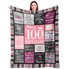 a woman holding up a blanket with the words 100th birthday written in pink and black