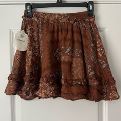 Nwt Western Style Ruffle Skirt. Super Cute Pattern Brown Mini Skirt For Summer, Brown Skirted Bottoms With Ruffled Skirt, Brown Skirted Bottoms With Ruffled Detail, Brown Ruffled Skirt Bottoms, Brown Ruffled Skirted Bottoms, Summer Pleated Brown Mini Skirt, Summer Brown Pleated Mini Skirt, Brown Bohemian Mini Skirt For Summer, Casual Brown Mini Skirt For Beach